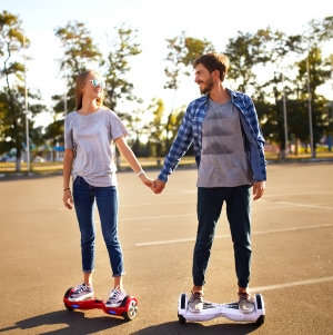 Man and Woman on Hoverboards